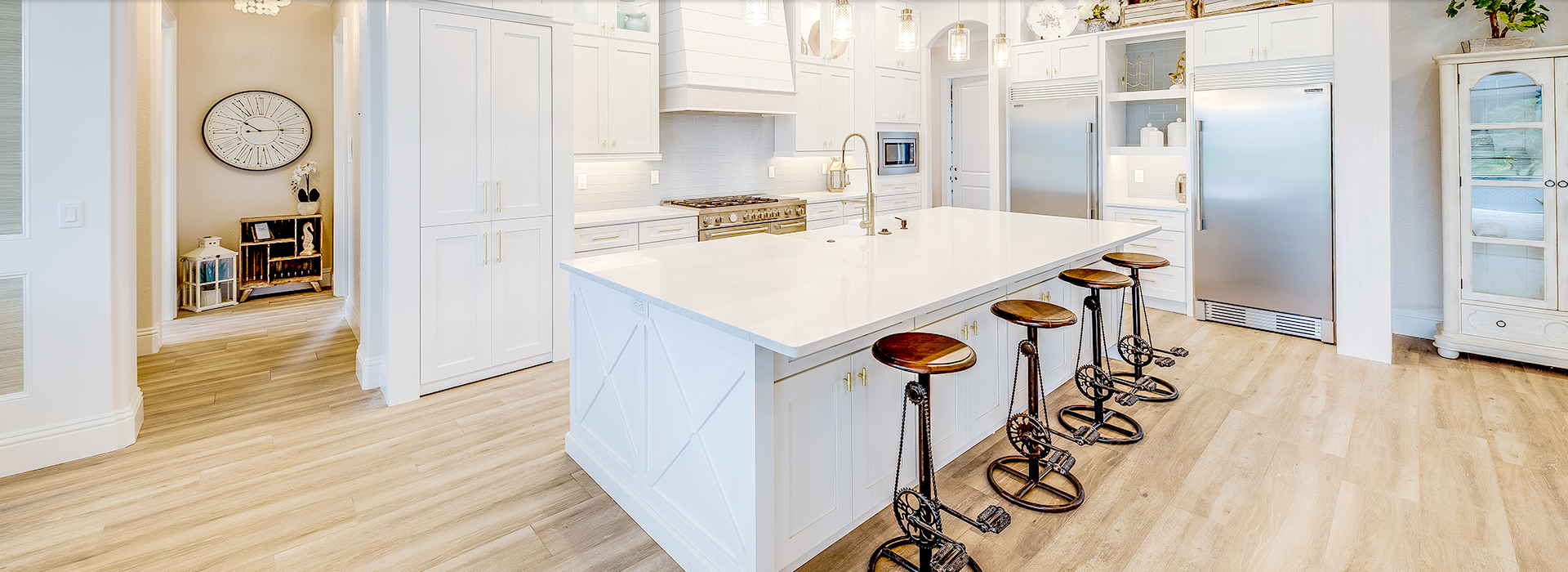 White kitchen with wood flooring